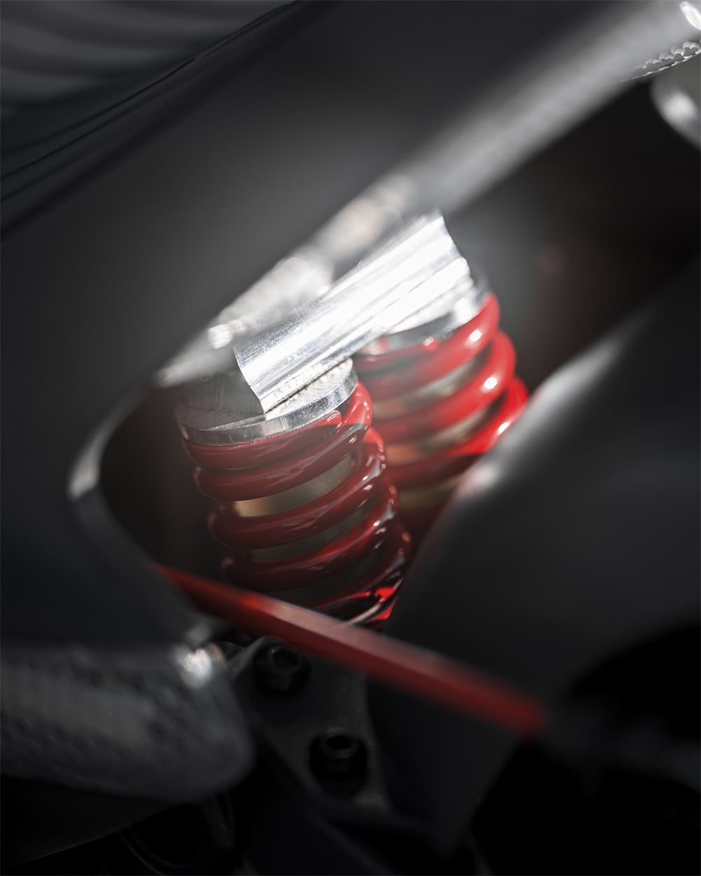 CUNFON RZ800 electric scooter rear shock absorber and damping suspension component closeup.